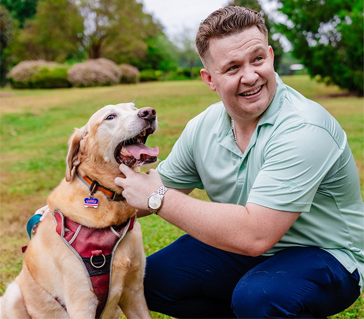 Republican Chris Stock petting a dog